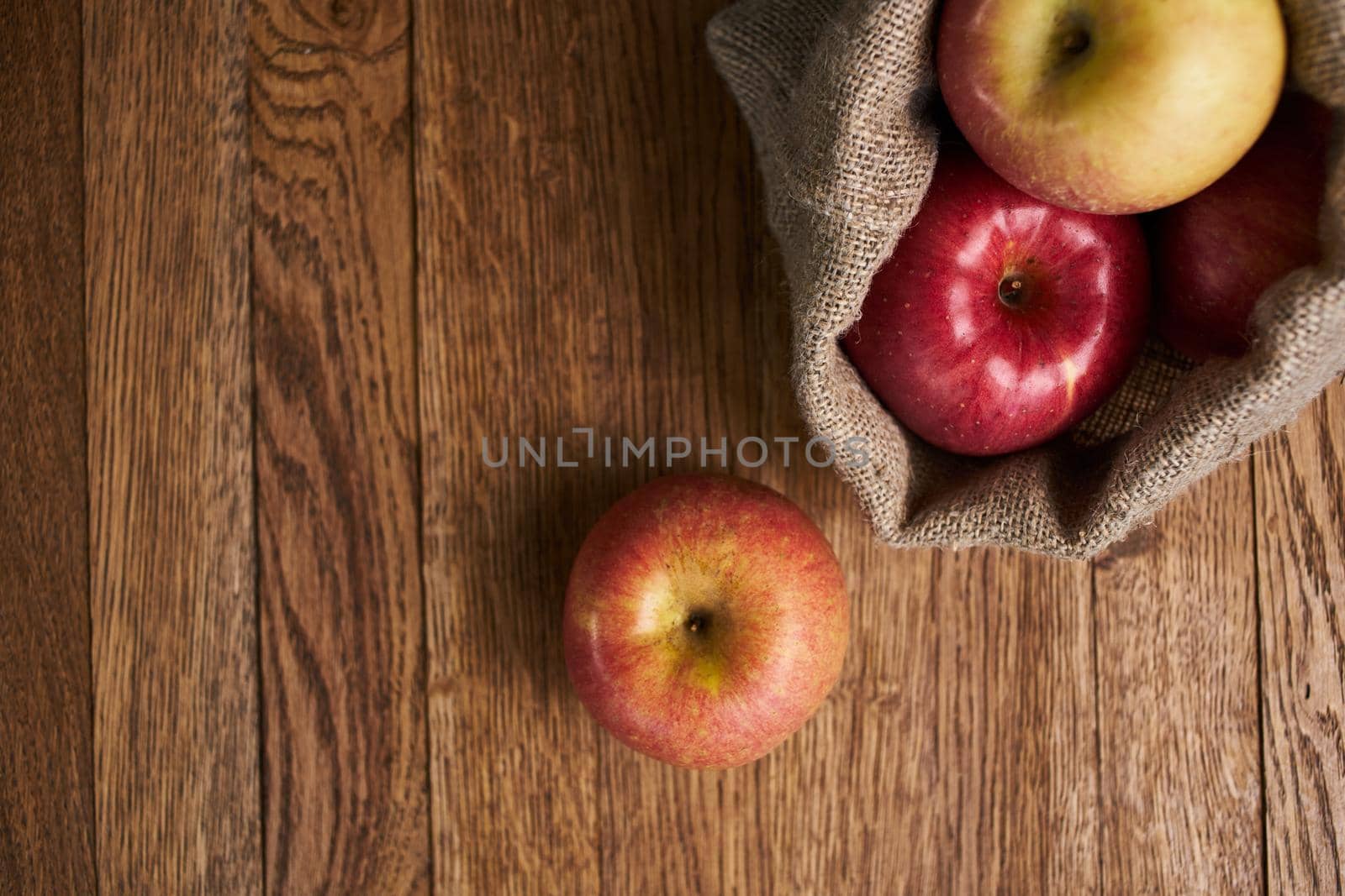 apples on a wooden table vitamins fresh fruits organic by Vichizh