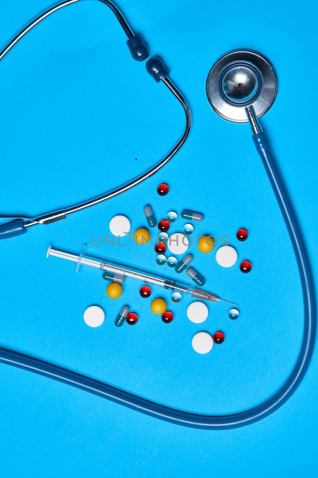 chemical antibiotics Pharmaceuticals medicines syringe blue background by Vichizh