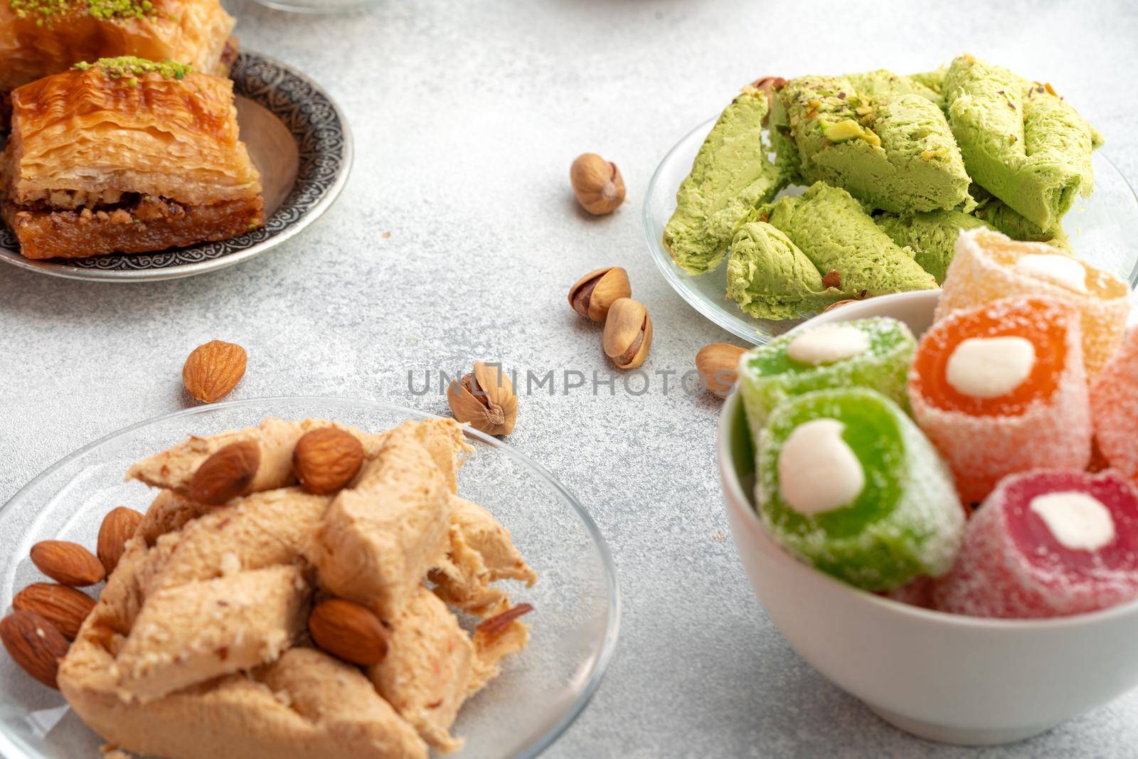 Close up photo of colorful Turkish halva sweets on gray surface