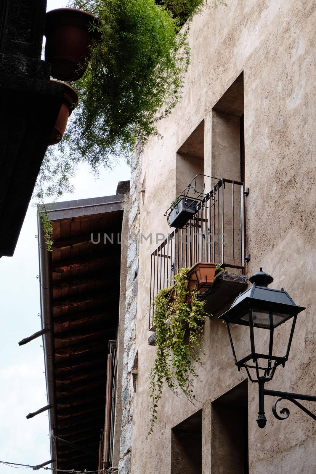 old facade balcony of the Renaissance with plants in the small village of (Breno - Brescia) - Lombardy - italy