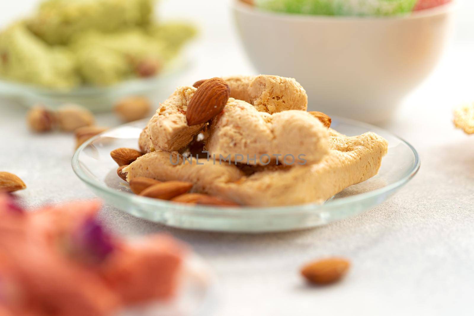 Close up photo of colorful Turkish halva sweets on gray surface