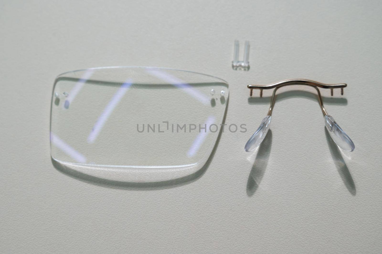 Disassembled glasses and instruments by an ophthalmologist
