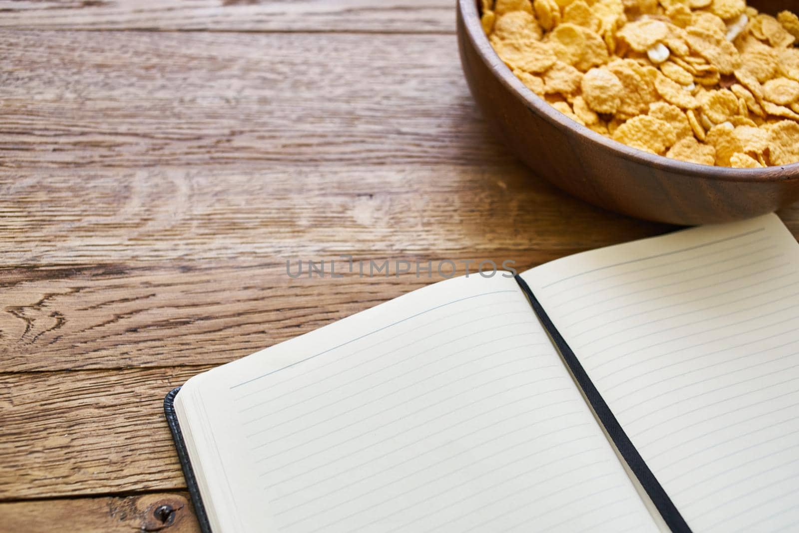 dry breakfast cereals notepad diet wooden background. High quality photo