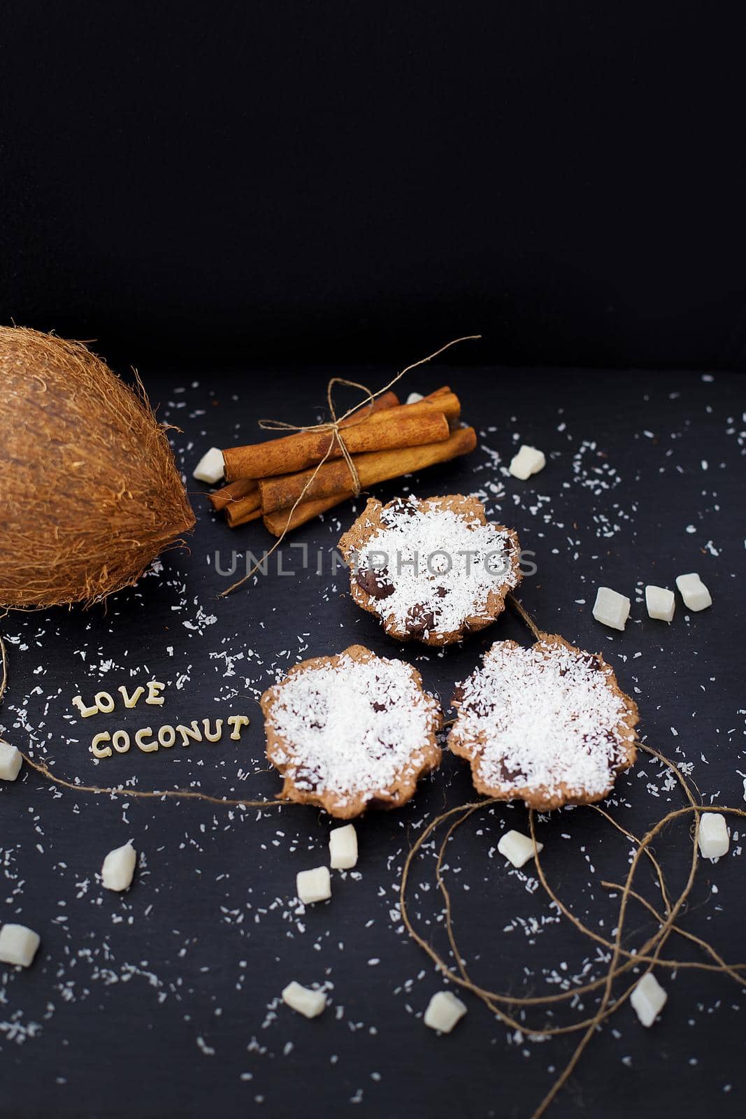 coconut muffins on a black background inscription love coconuts, close-up