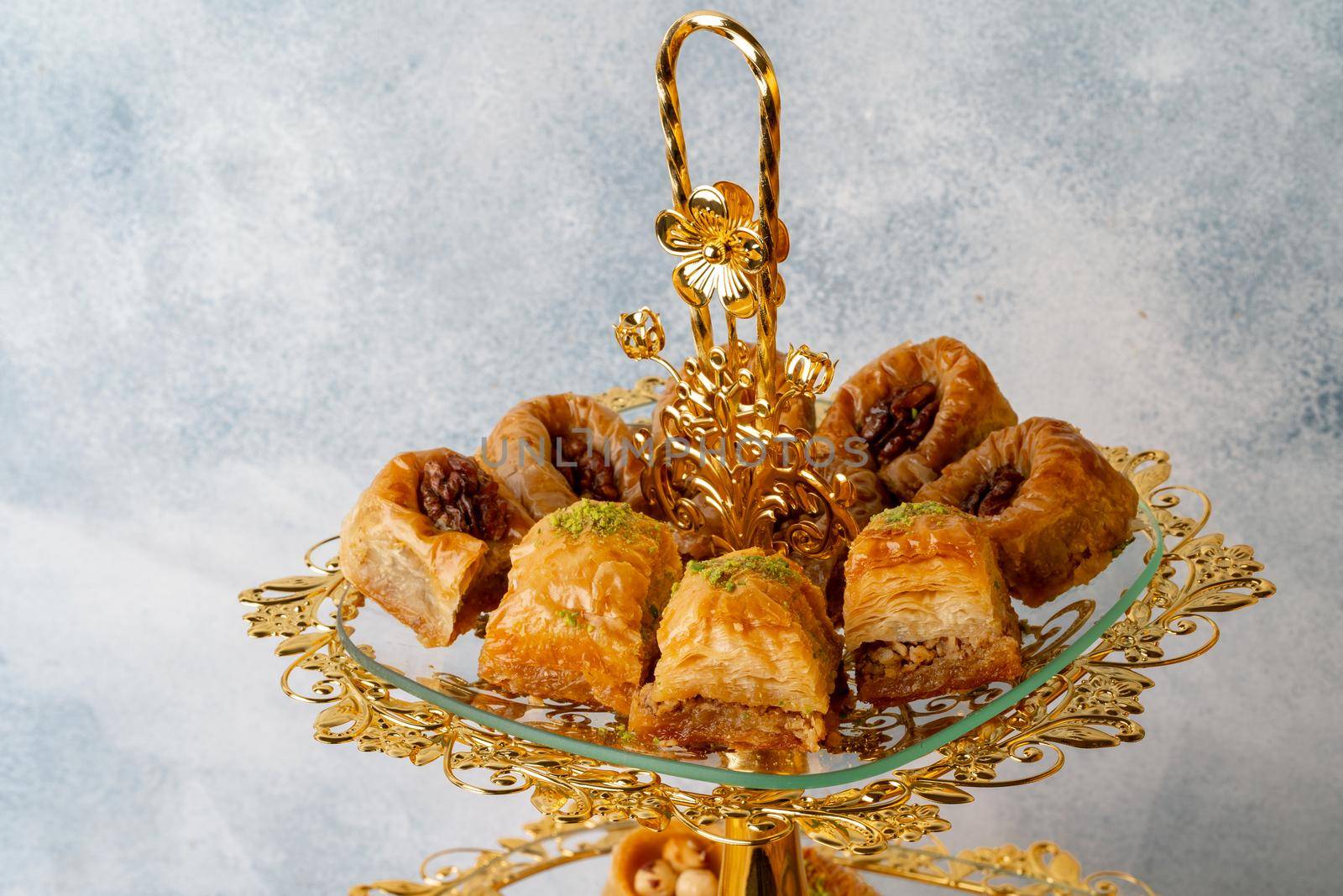 Variety of Turkish desserts served on cake stand, close up