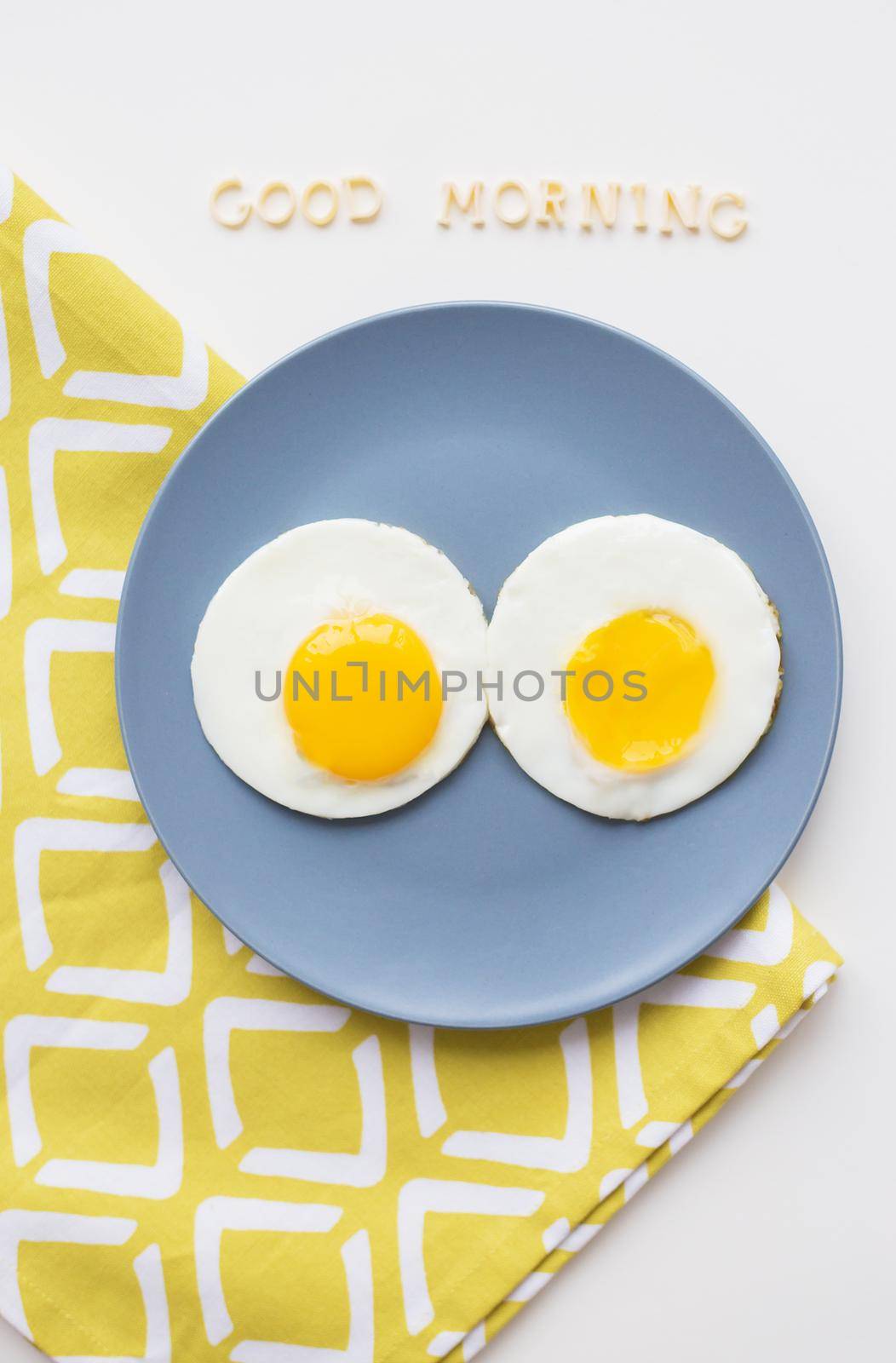 two beautiful eggs on a plate by sfinks