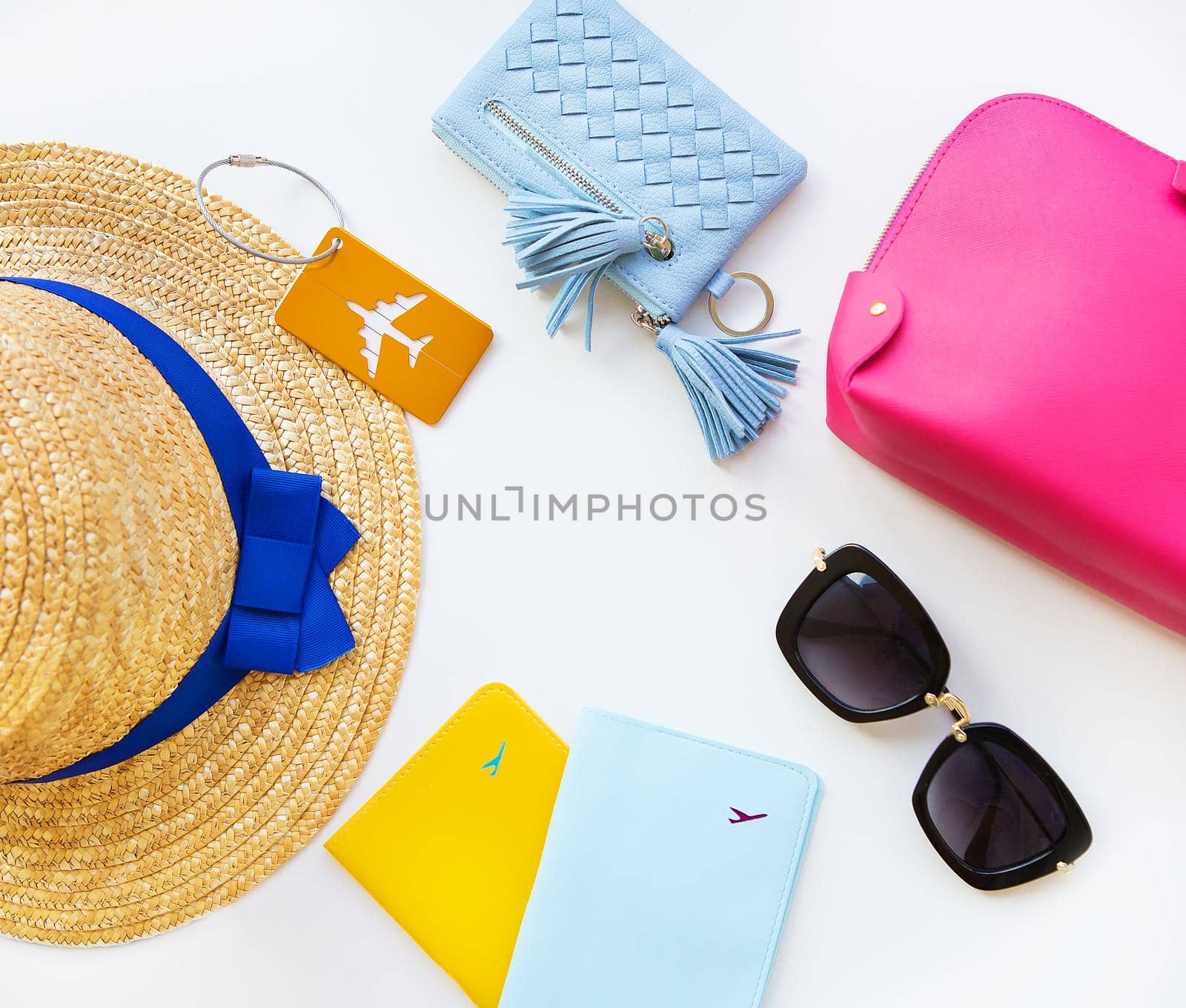 Preparation for vacation - hat, glasses, passport, cosmetic bag, purse. Close-up by sfinks