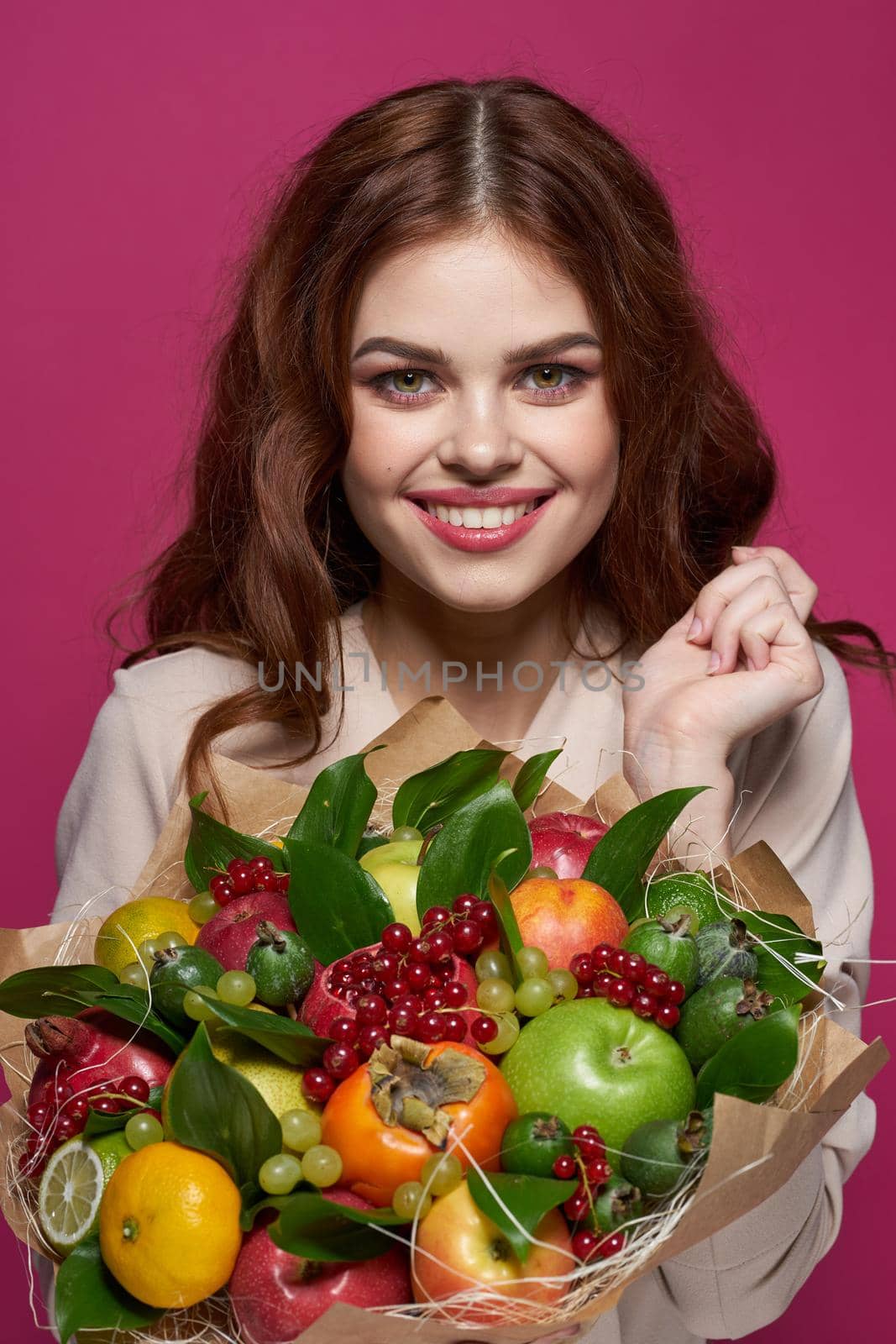 portrait of a woman fashionable hairstyle bouquet of flowers decoration pink background. High quality photo