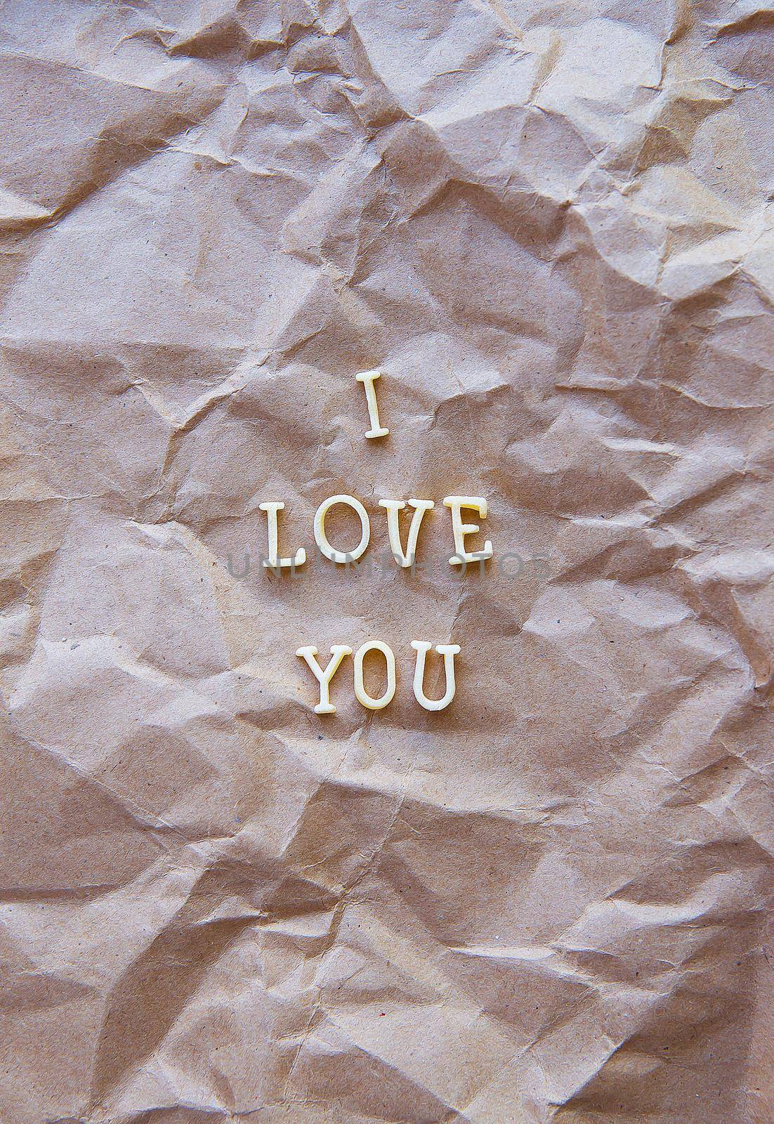 I love you written on kraft paper. valentine card