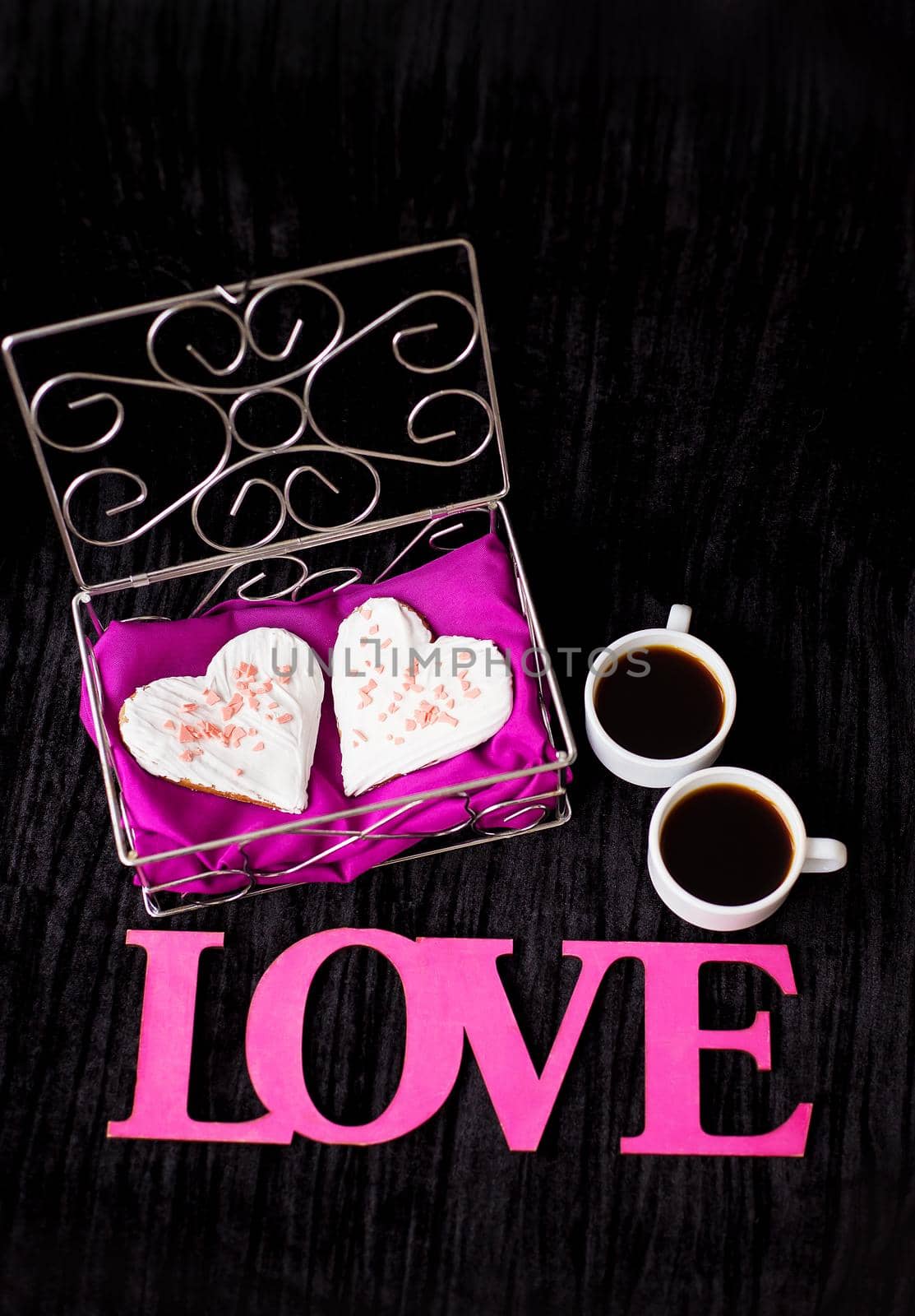 two cups of coffee, cookies in the form of heart inscription love.