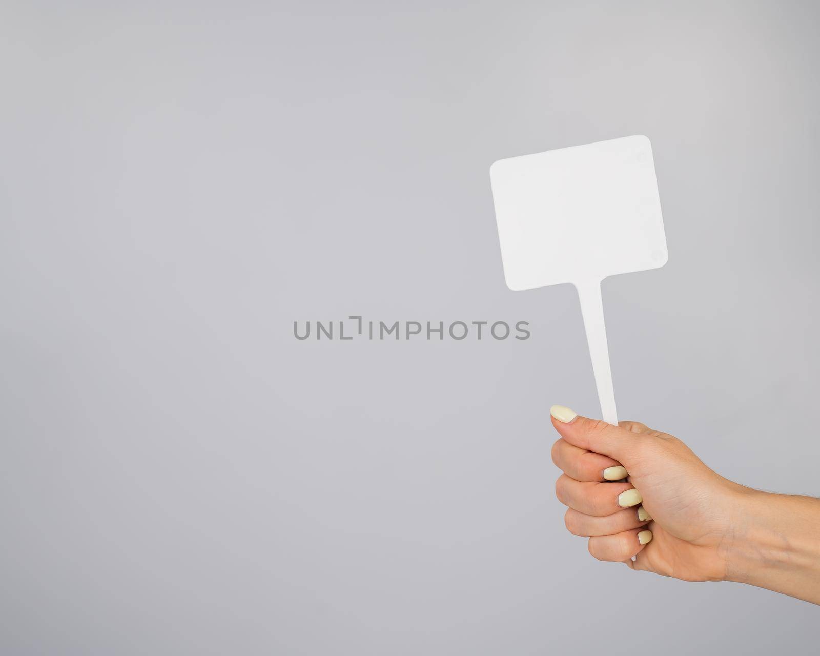 Woman holding blank sign on white background. Copy space. by mrwed54