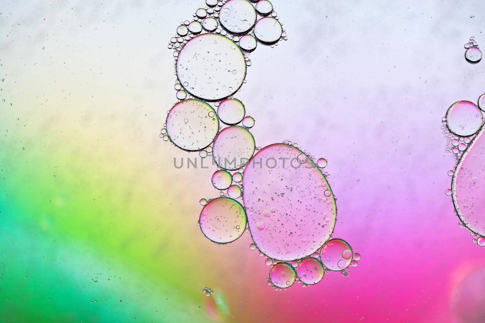 Colorful abstract background with oil drops on water by anytka