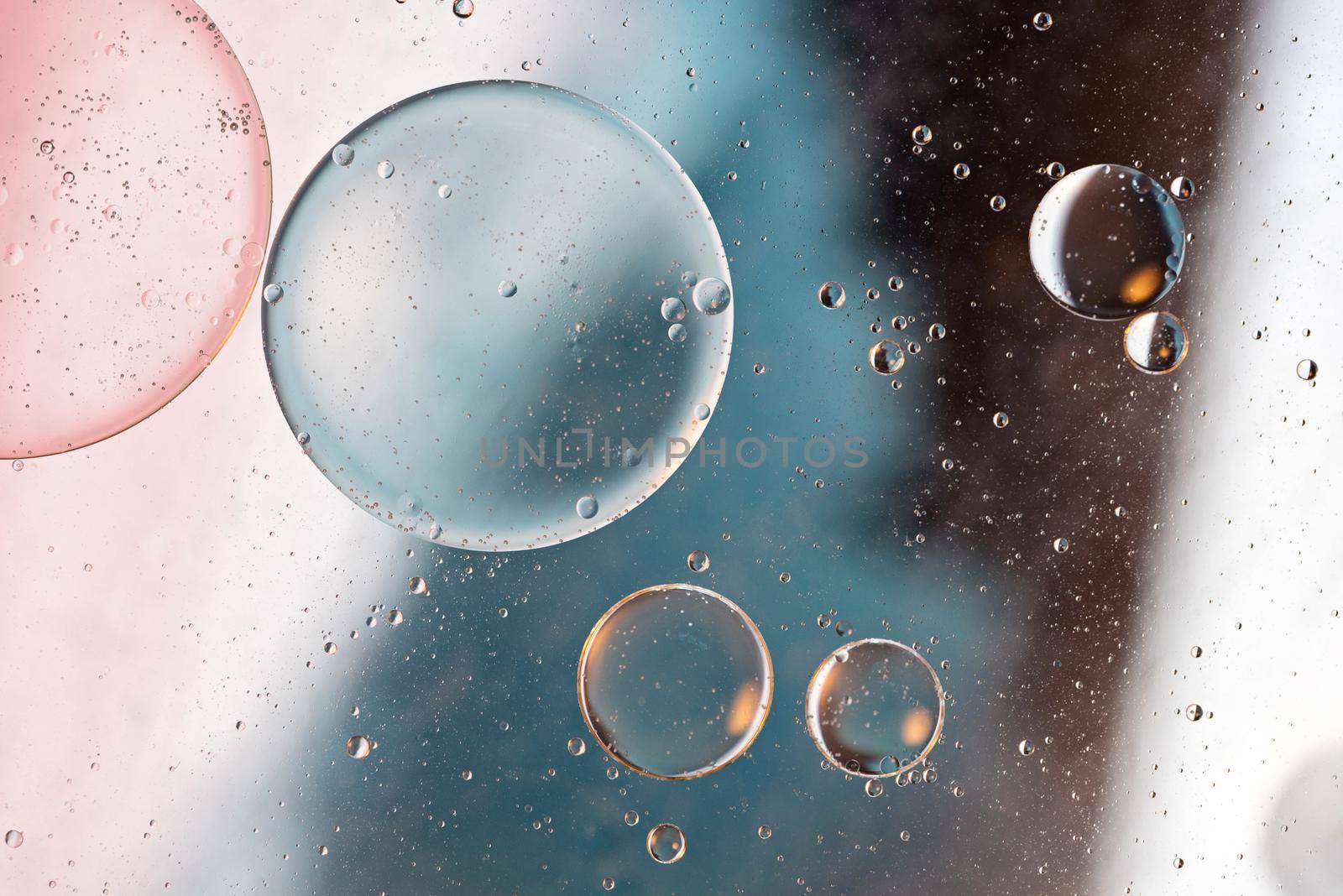 Colorful abstract background with oil drops on water by anytka