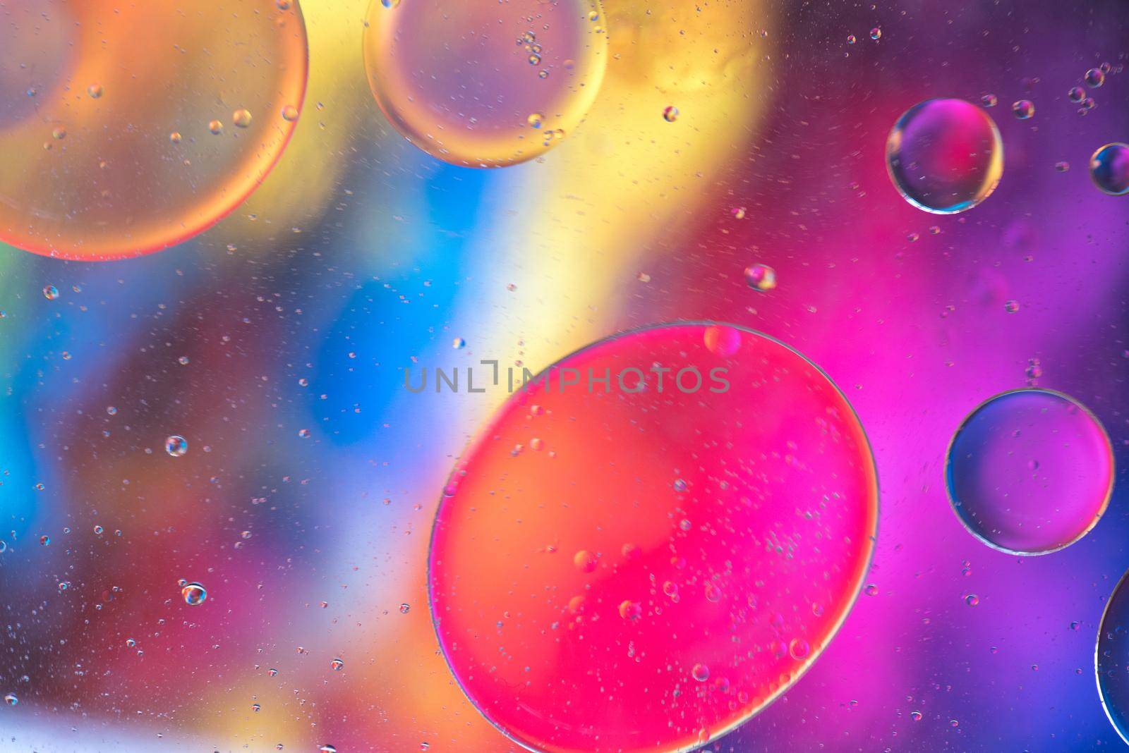 Rainbow abstract background picture made with oil, water and soap by anytka