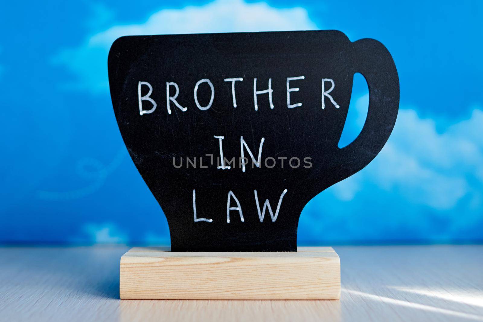 Chalk table tent with english word "Brother in law" written by white chalk marker