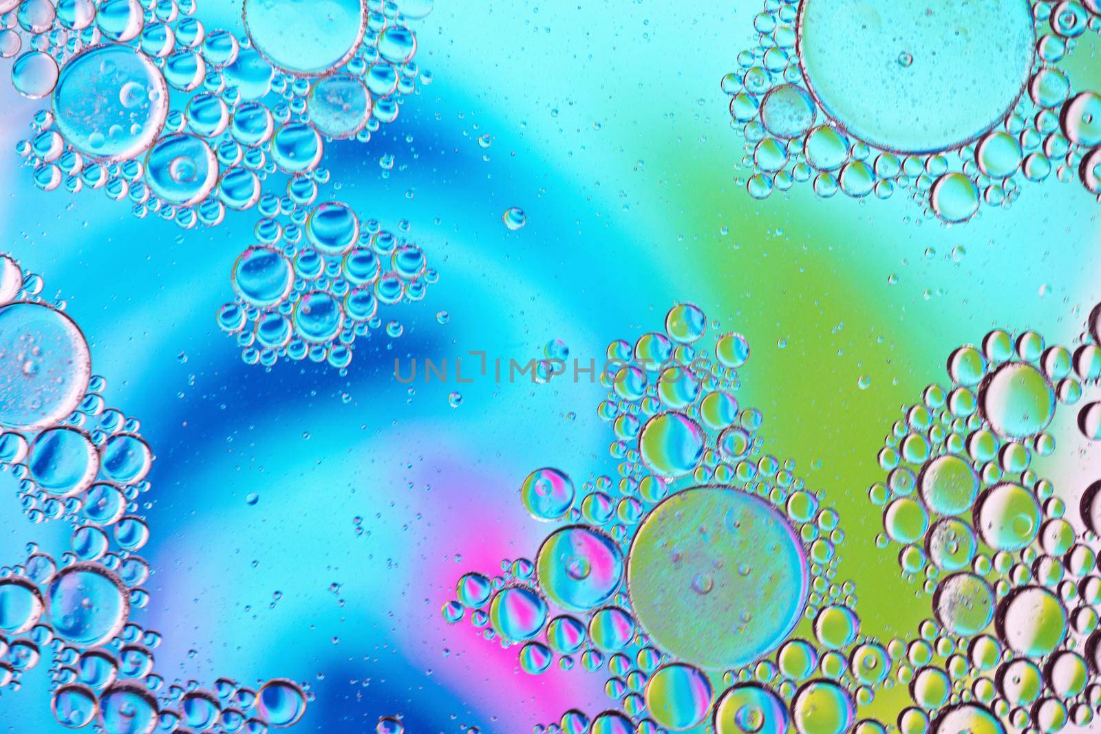 Colorful abstract background with oil drops on water. Rainbow color