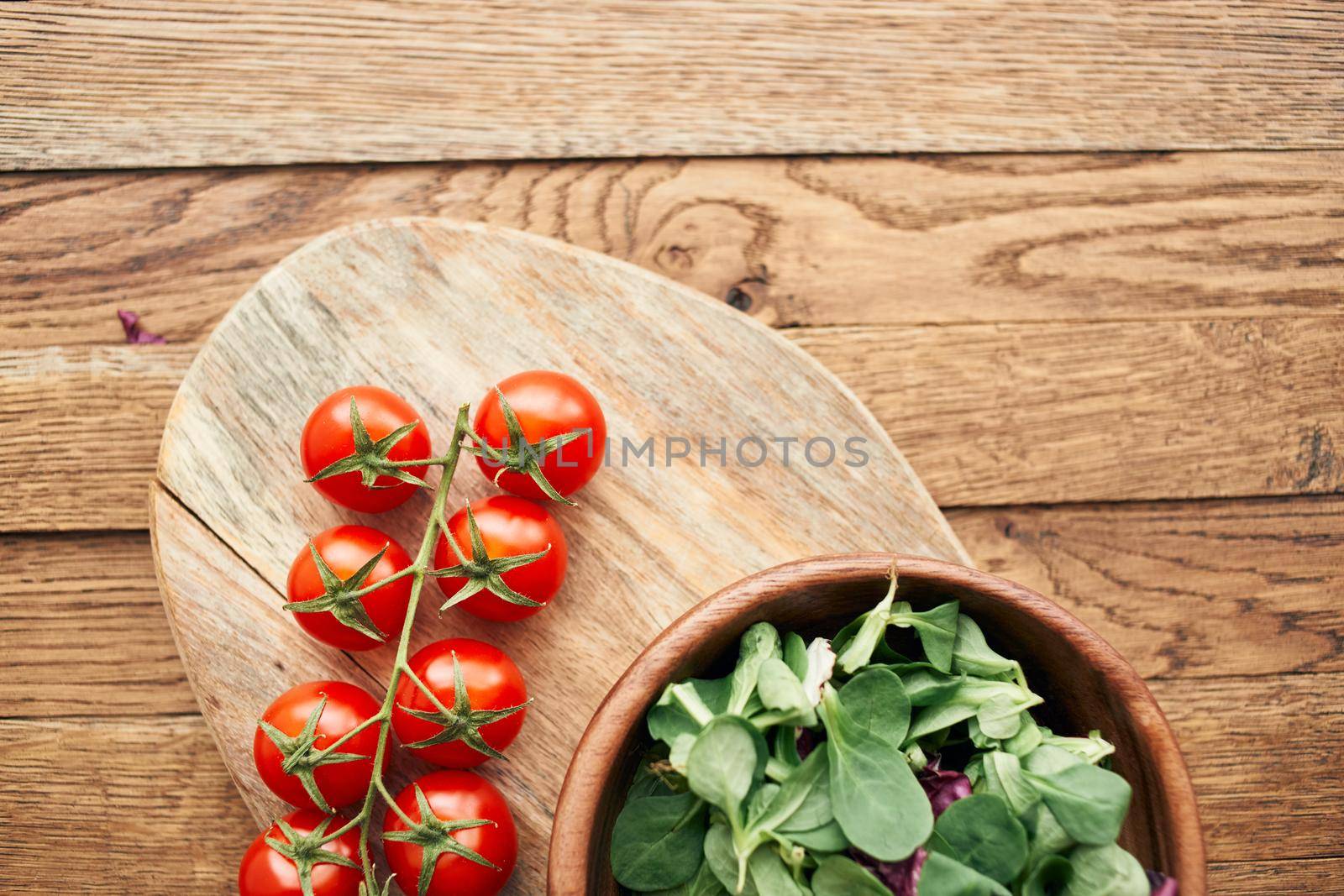 a plate of lettuce cherry tomatoes cooking ingredients organic healthy food. High quality photo