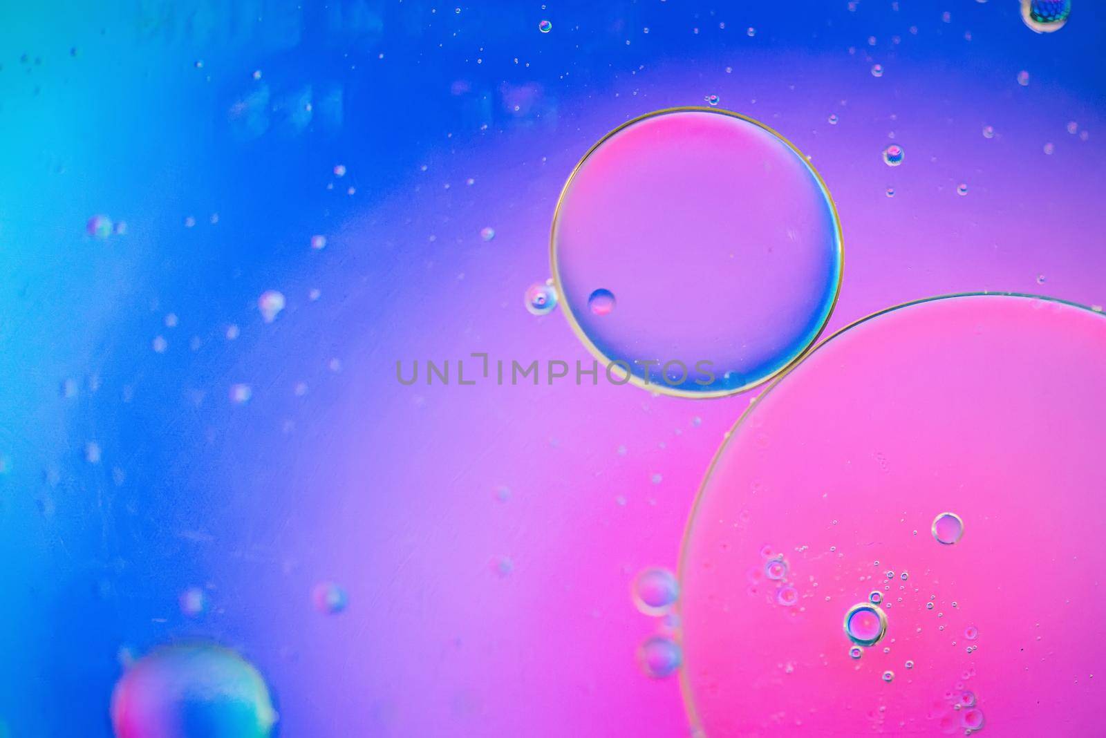 Oil drops in water. Abstract psychedelic defocused pattern image multicolored. Abstract background with colorful gradient colors. DOF