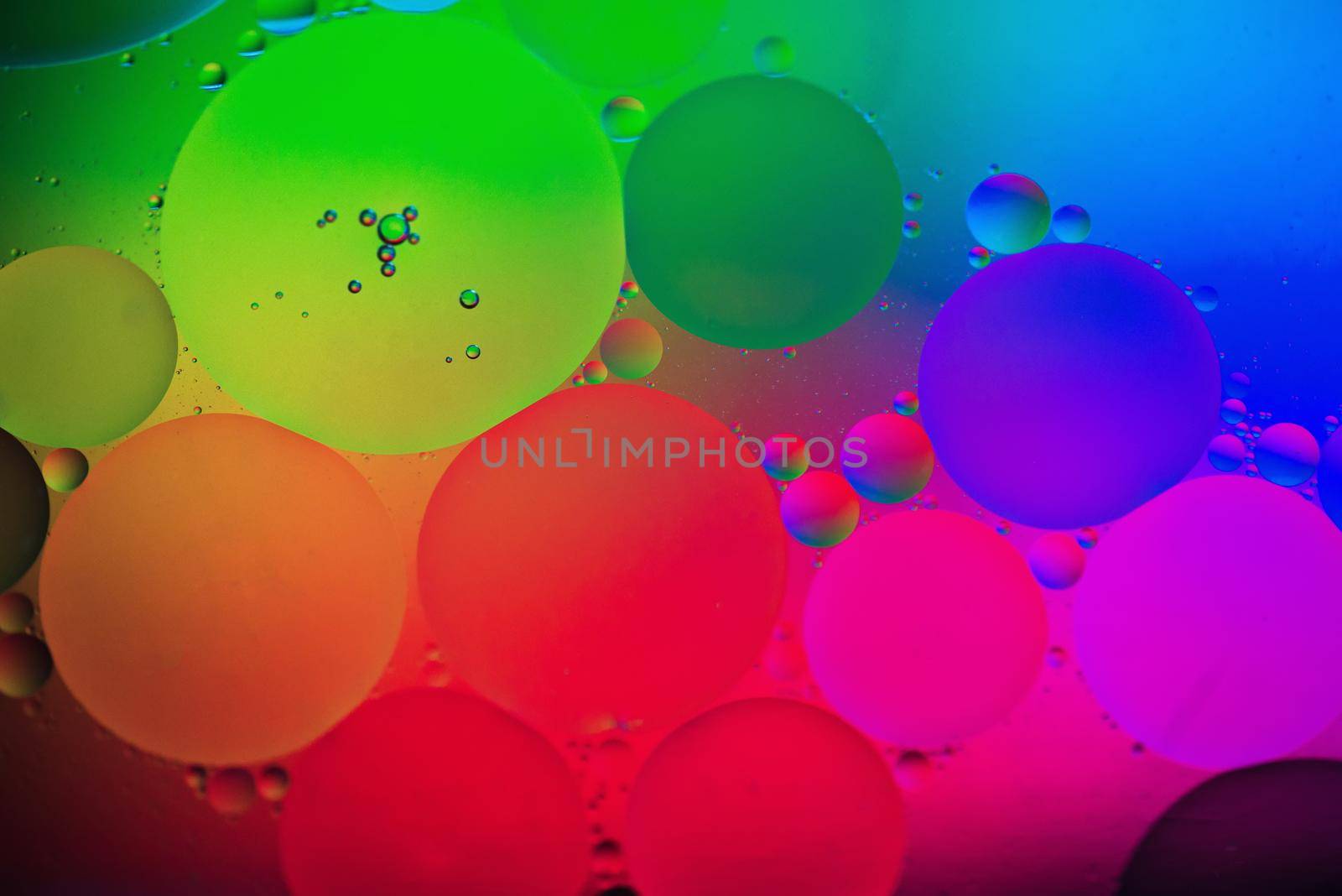 Oil drops in water. Abstract psychedelic pattern image rainbow colored. Abstract background with colorful gradient colors. DOF