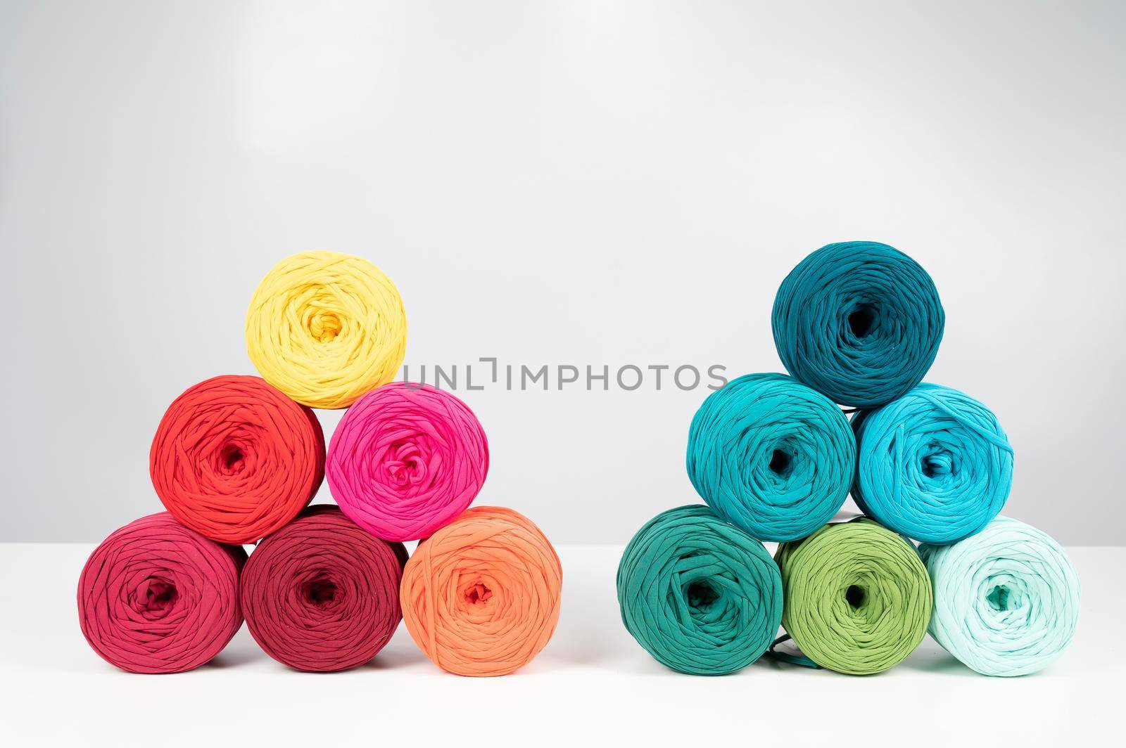 Rows of multicolored cotton yarn. The assortment of the store for needlework