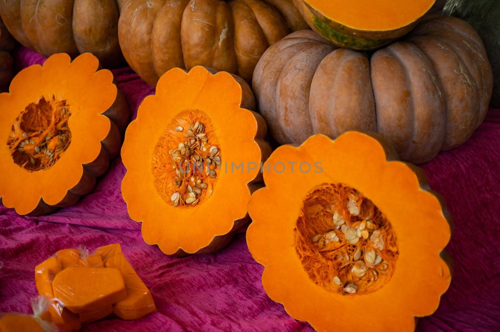 Close-up of ripe pumpkins at the bazaar. Background. Texture