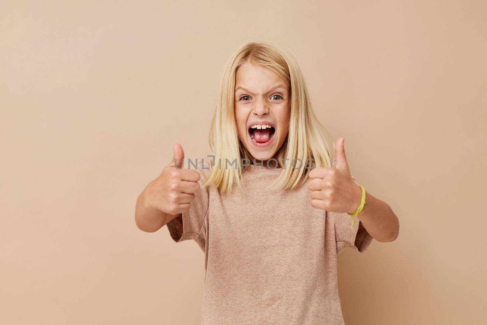 happy cute girl Fashion textile baby clothes template on a beige background. High quality photo