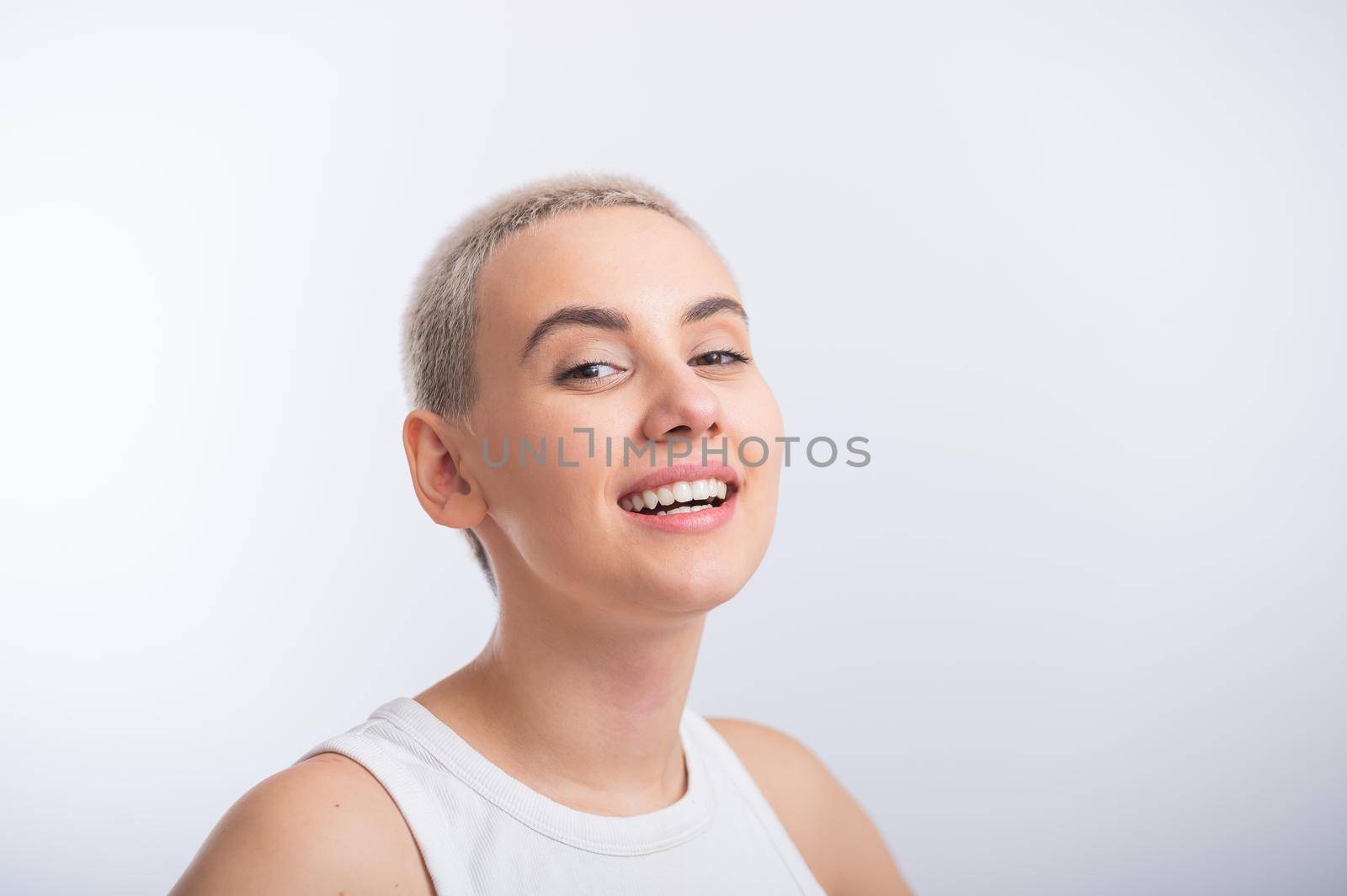 Young caucasian woman with short hair on a white background. by mrwed54