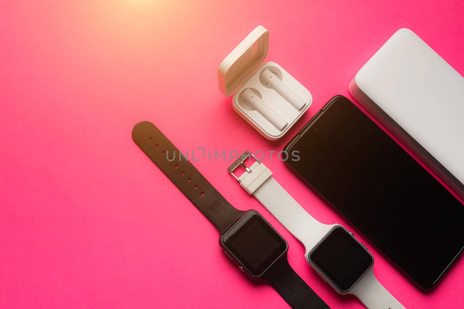 Layout of modern gadgets on a pink background . Online communication. Internet connection. Mobile communication. 5g. Black and white technology. Modern technologies. Copy space