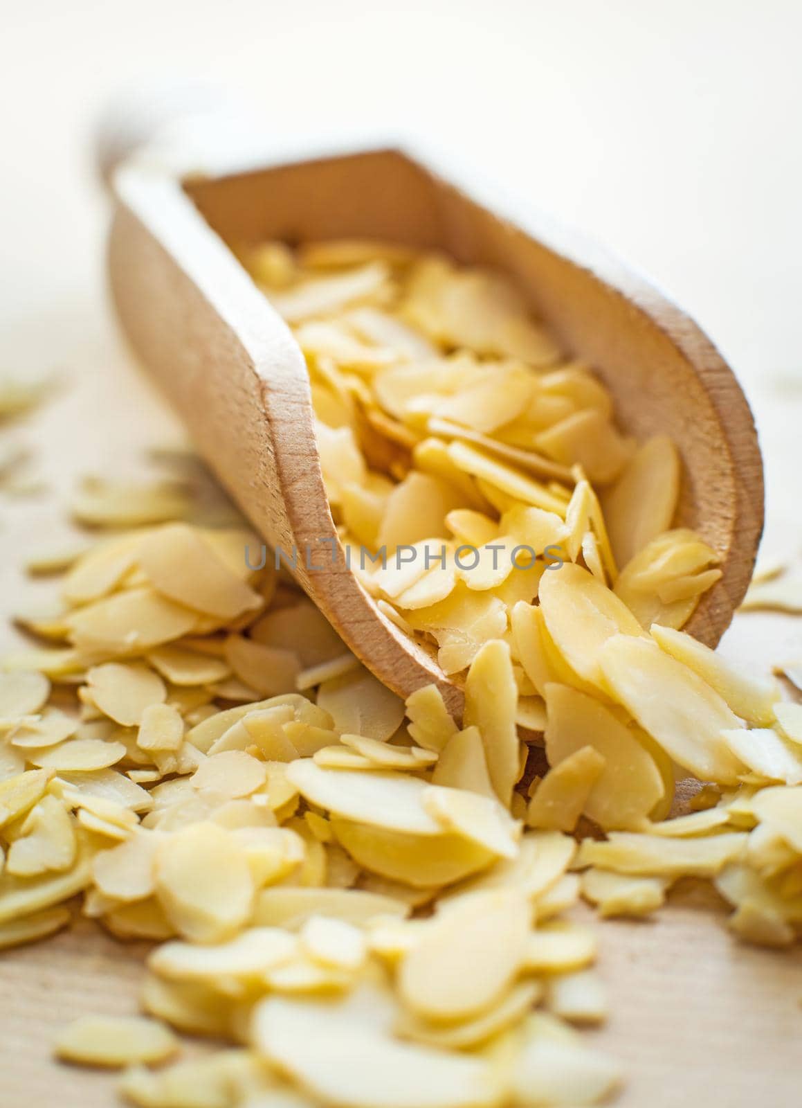 sliced almonds in a wooden spoon