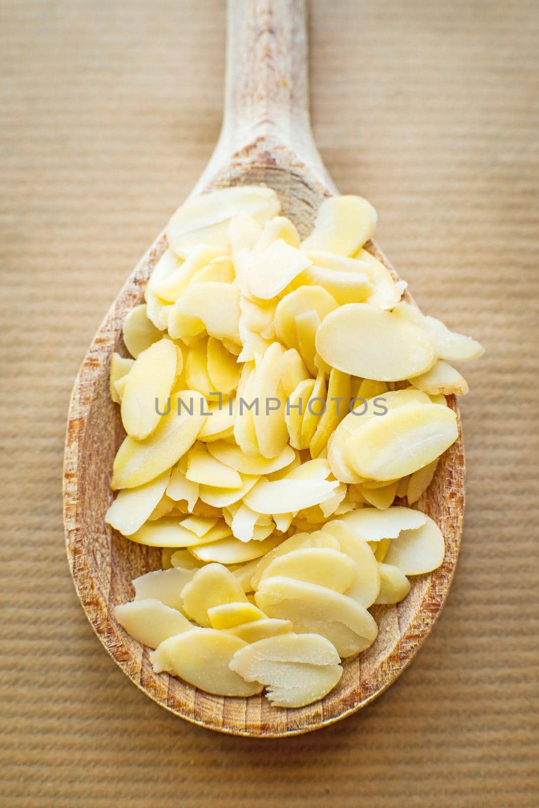 sliced almonds in a wooden spoon