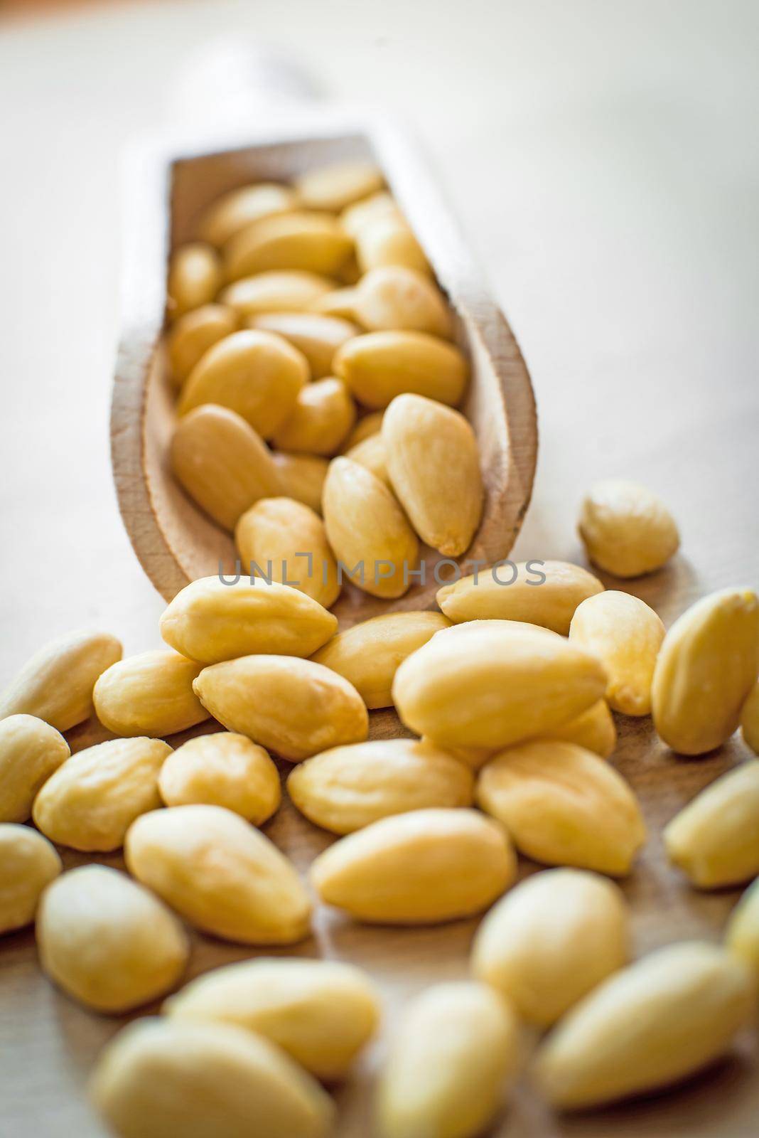 almonds in a wooden spoon