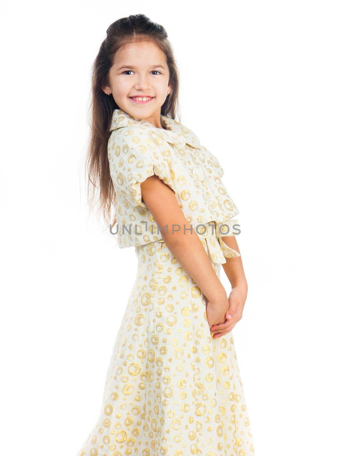 Cute little girl in a light dress isolated on white background