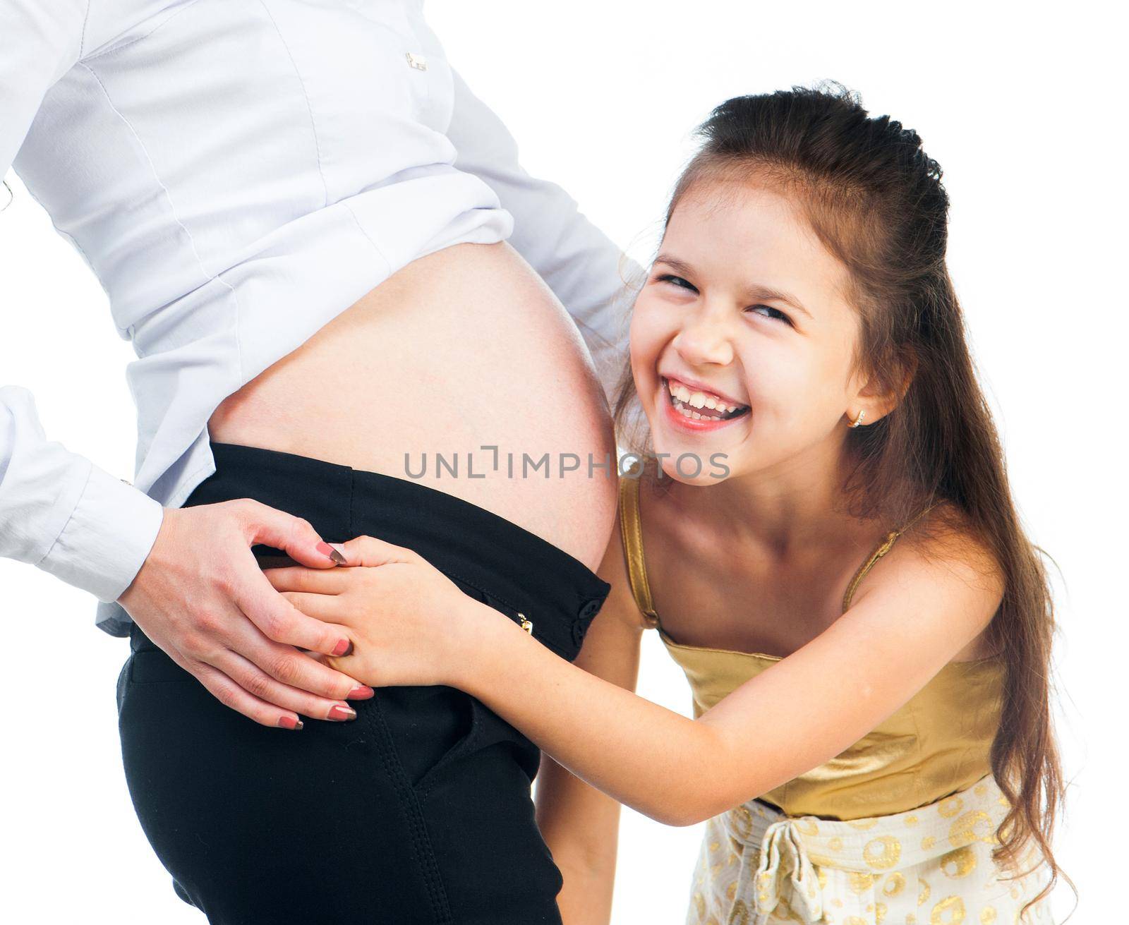 cute little girl hugging belly pregnant mom