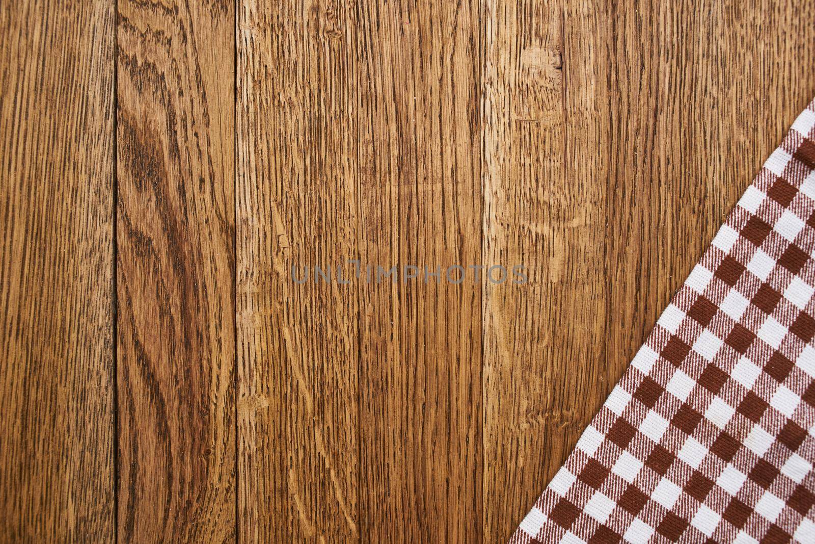 wooden table plaid tablecloth decoration kitchen top view. High quality photo