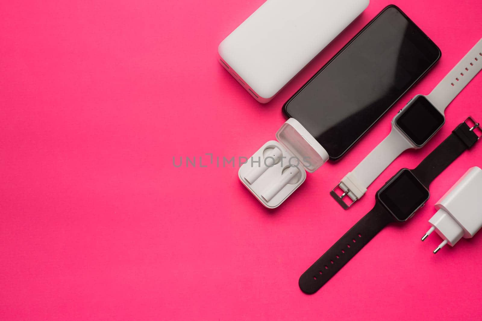 Layout of modern gadgets on a pink background . Online communication. Internet connection. Mobile communication. 5g. Black and white technology. Modern technologies. Copy space