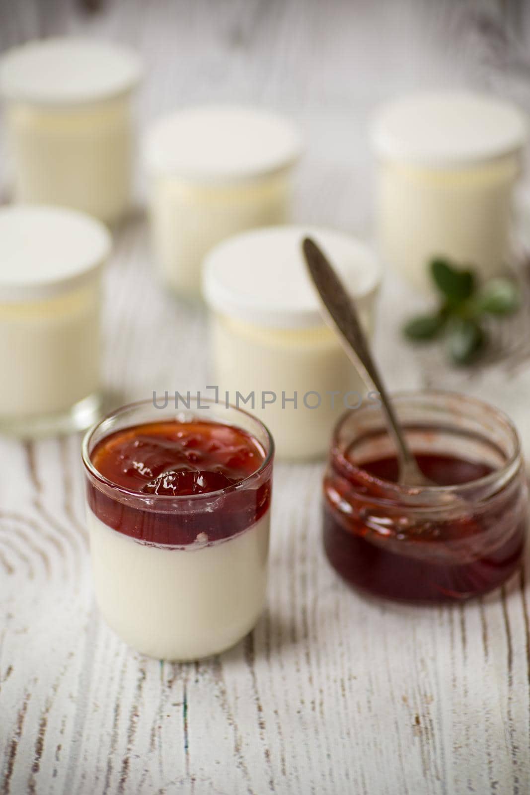 homemade sweet yogurt with fruit jam in a glass on the table