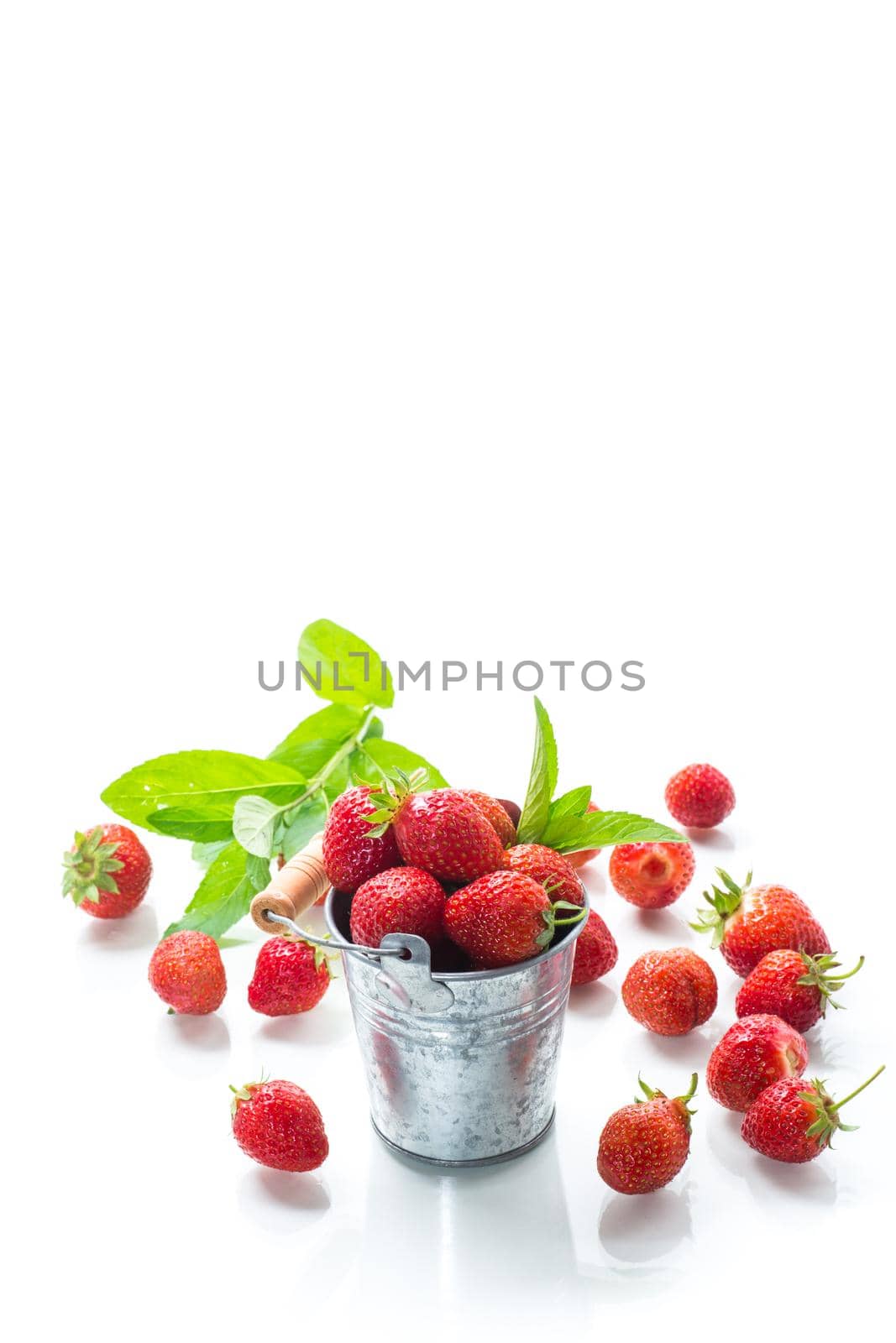 harvest of red ripe natural strawberries isolated on white background