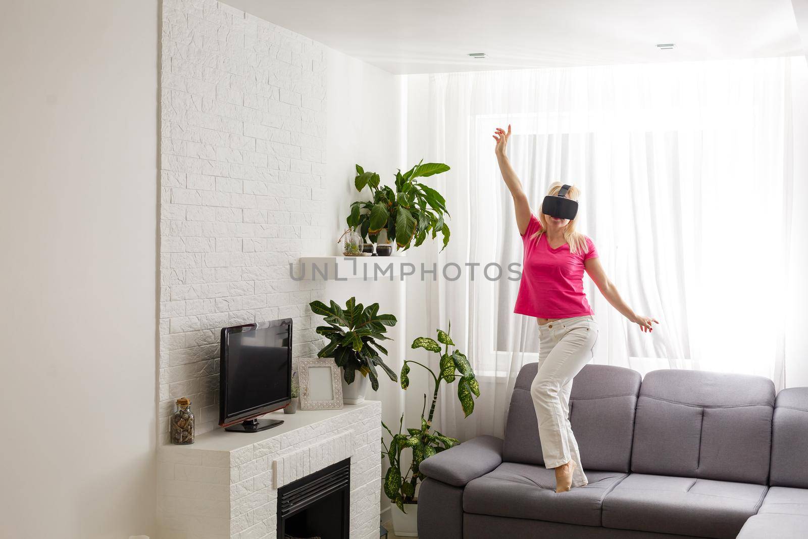 Woman using the virtual reality headset, virtual glasses