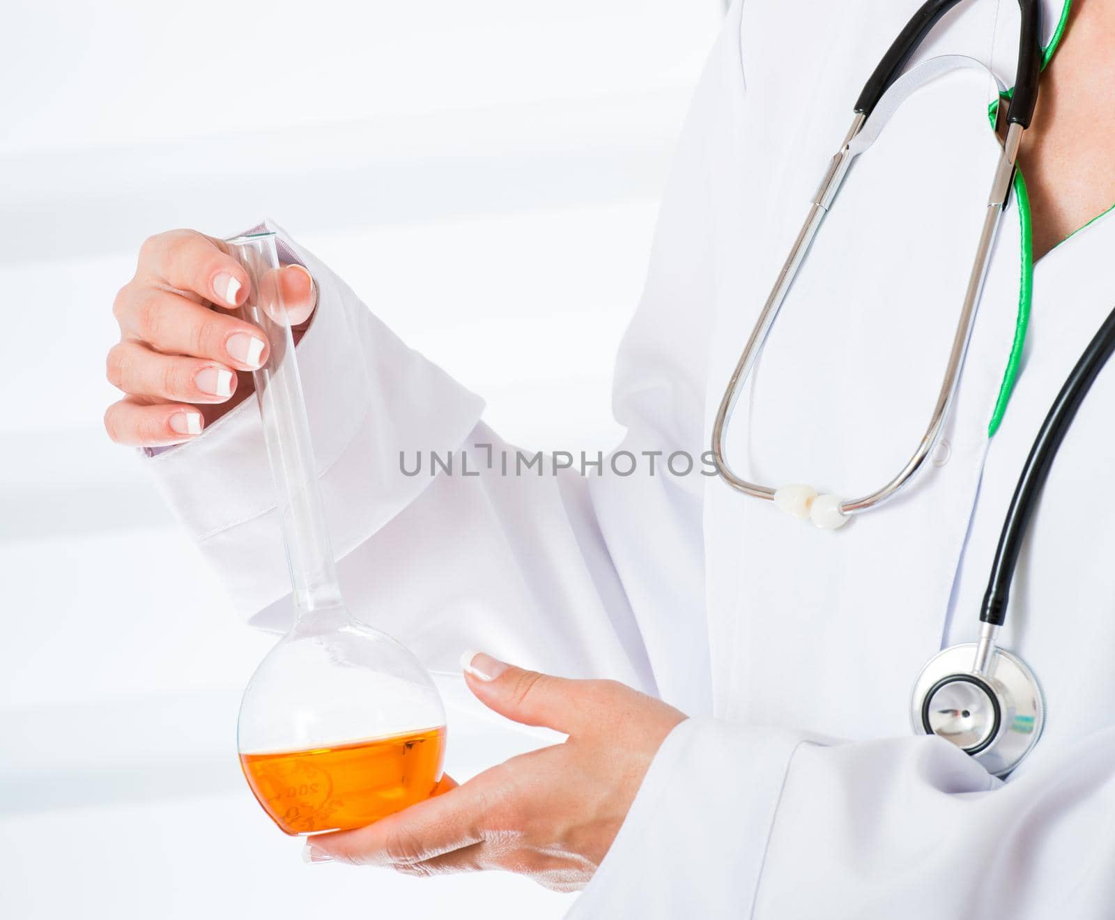 Doctor's hands with a flask
