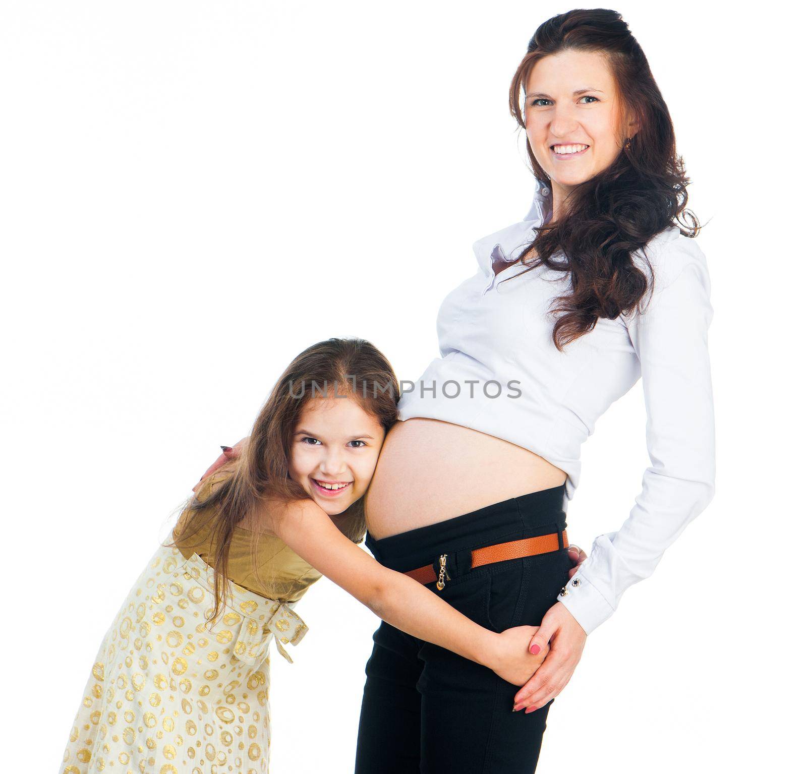 cute little girl hugging belly pregnant mom
