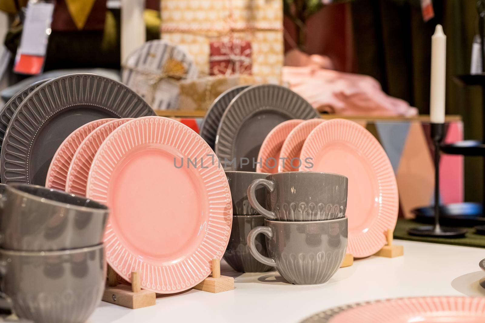 New gray, pink table setting . modern style. Serving for store catalog. Hot drinks tea or coffee. Stylish elegant ceramic dishware on shop shelves,Various kitchen utensils.Tender, pastel color by YuliaYaspe1979