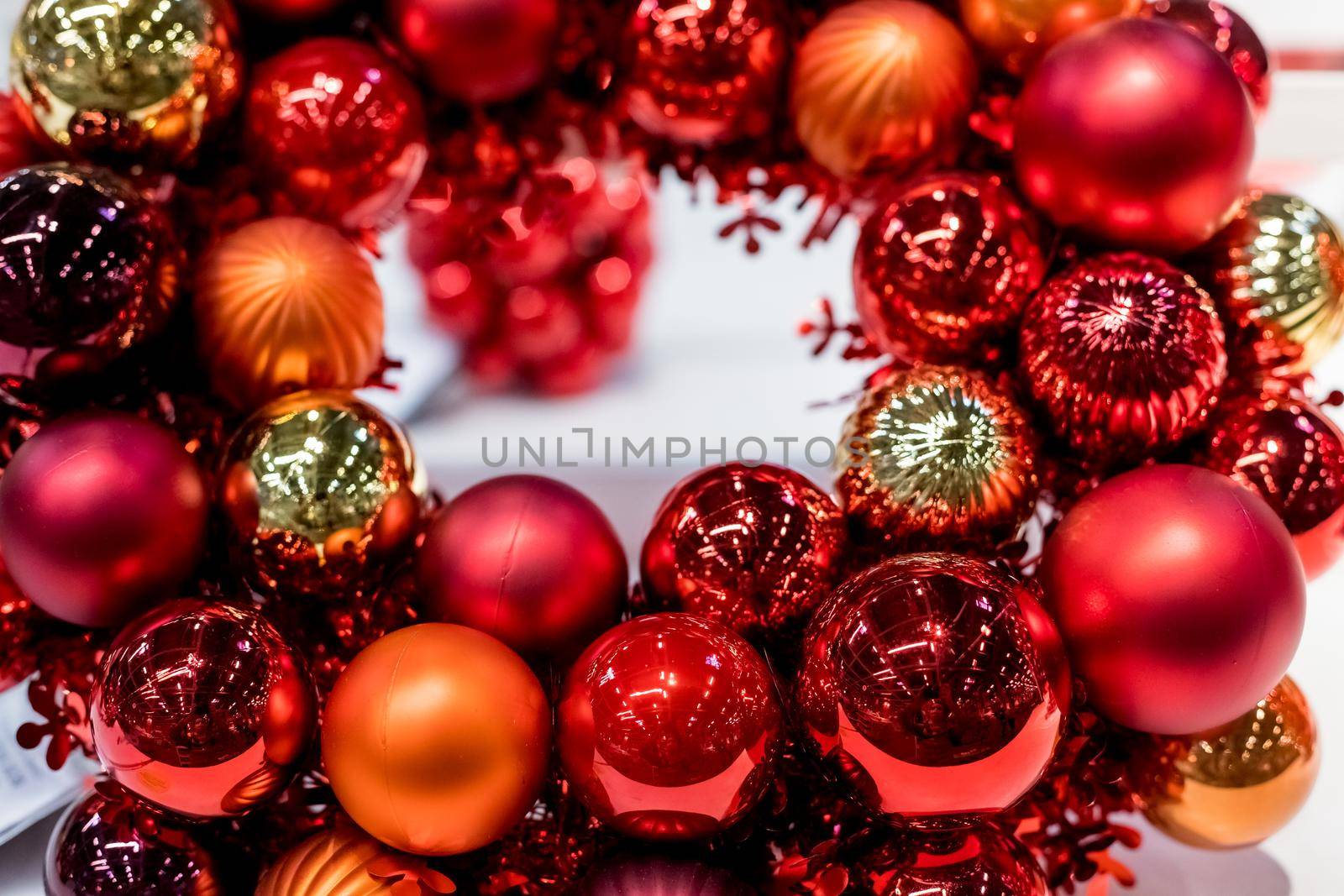 Holiday round frame, red and orange glass Christmas balls, isolated on blurred background.Happy new year decoration for home. Merry Christmas. Advent Christmas wreath by YuliaYaspe1979