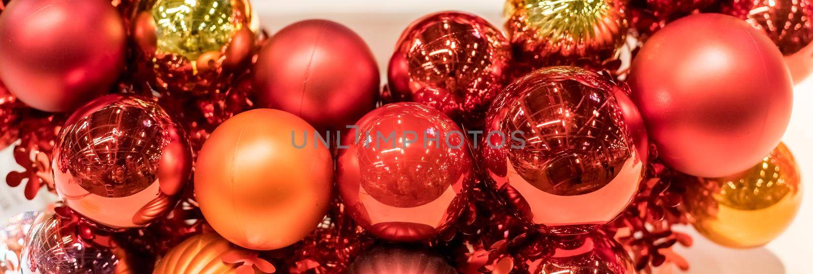 Christmas wreath with glass pink and violet balls isolated on white background