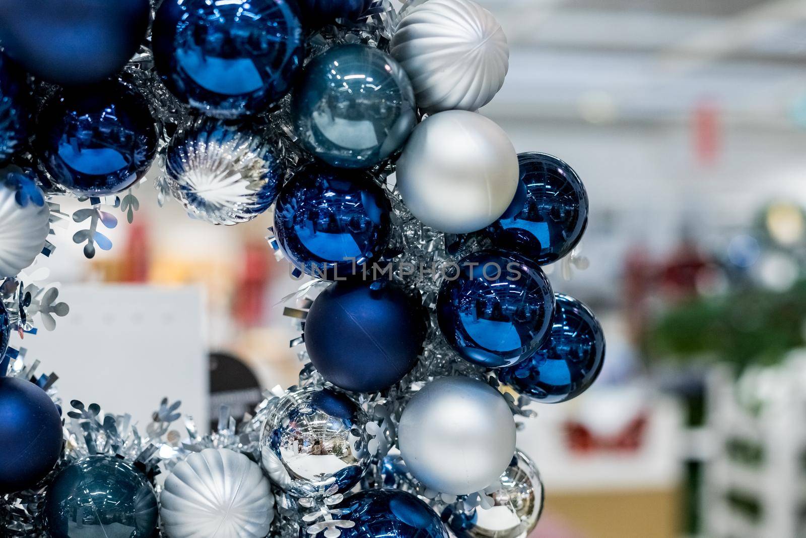Holiday round frame, silver and blue glass Christmas balls, isolated on blurred background.Happy new year decoration for home. Merry Christmas. Advent Christmas wreath by YuliaYaspe1979