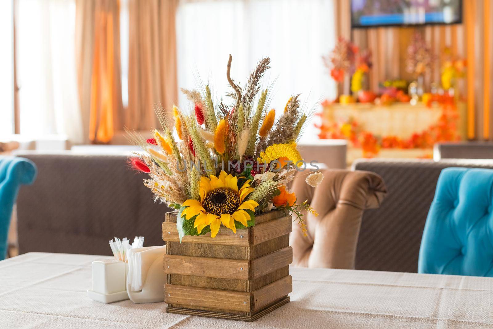 Fall and autumn floral arrangement on home's coffee table - ideal for Thanksgiving holidays