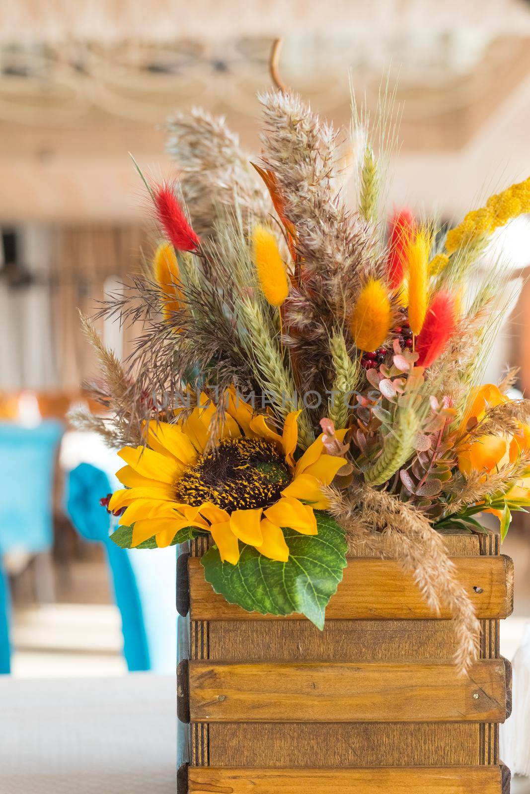 Fall and autumn floral arrangement on table - ideal for Thanksgiving holidays.Autumn bouquet of beautiful flowers, pumpkin in wooden box. festive decoration for Thanksgiving day. by YuliaYaspe1979