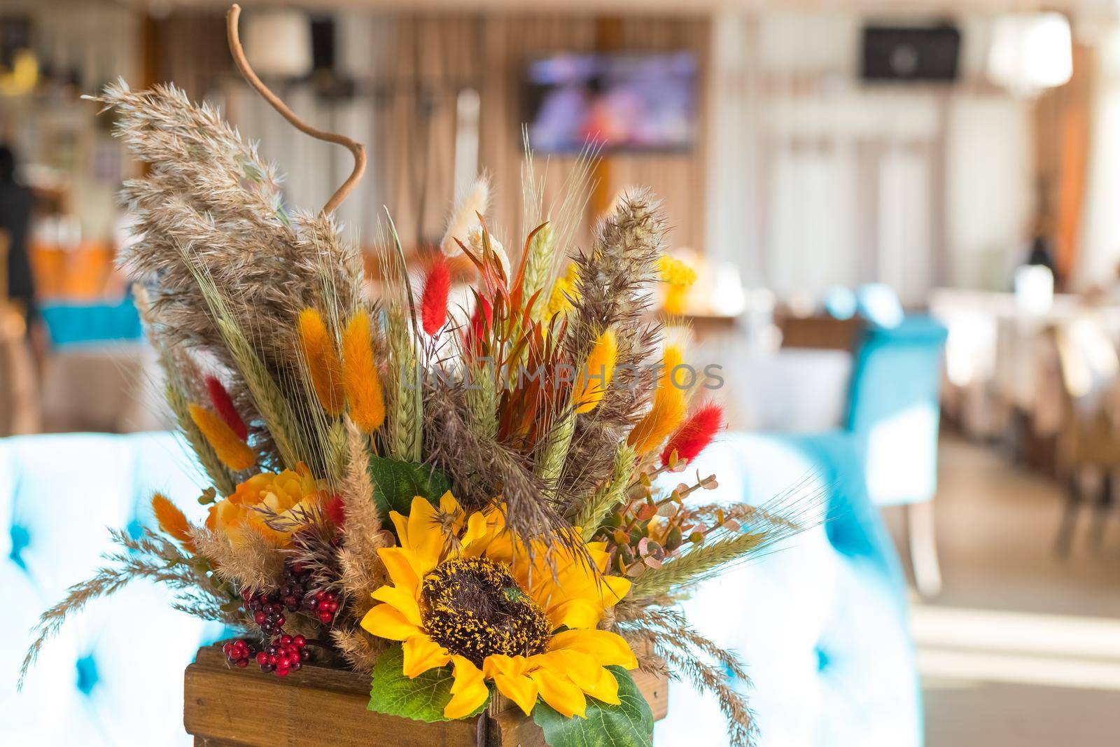 Fall and autumn floral arrangement on home's coffee table - ideal for Thanksgiving holidays