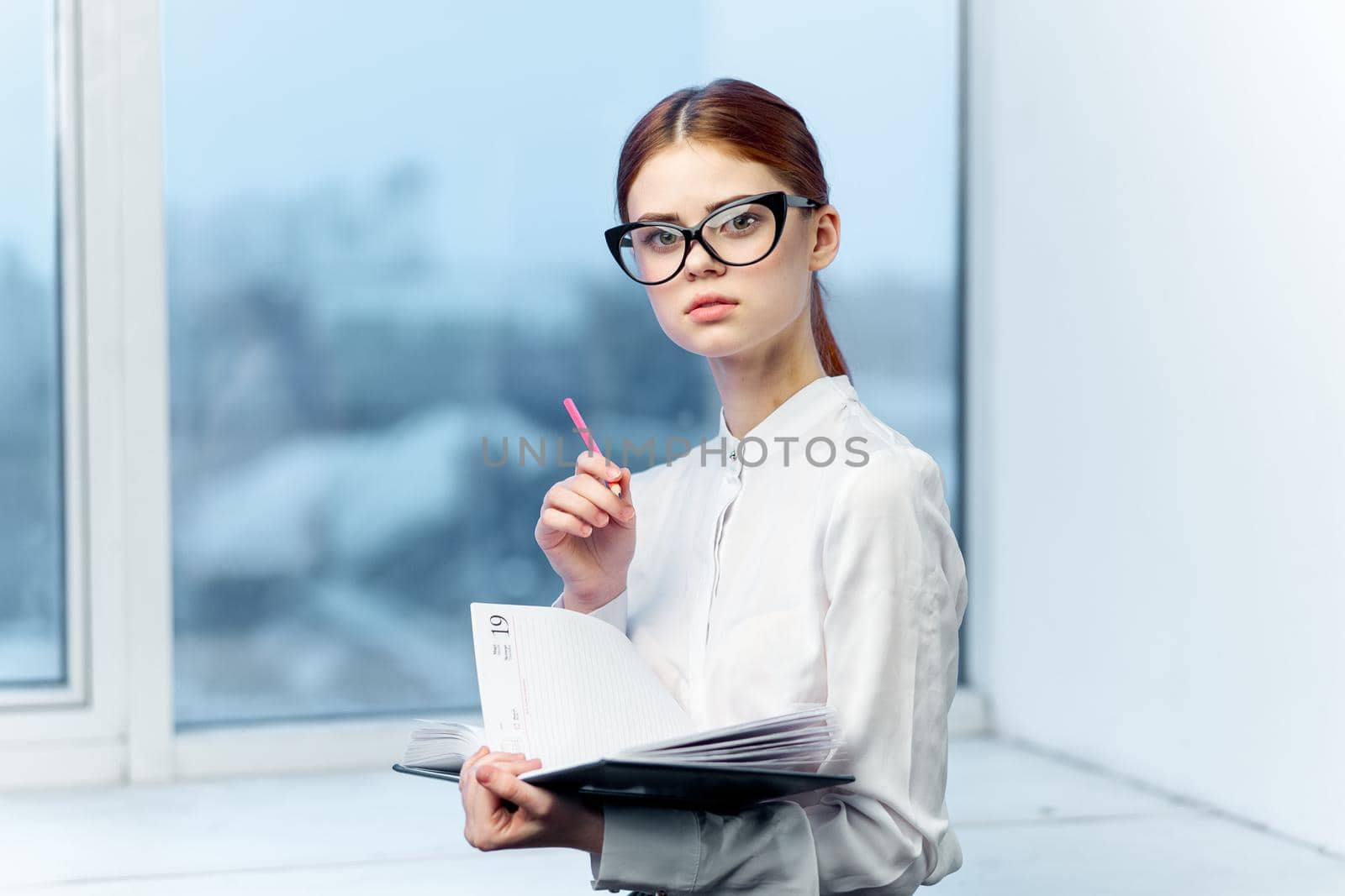 woman secretary in white shirt office work professional. High quality photo