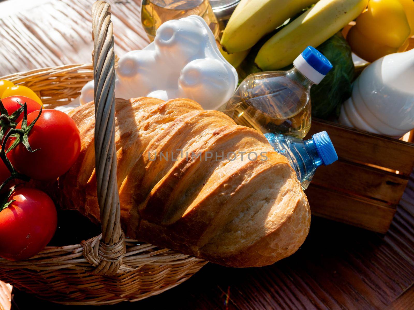 Female volunteer puts in a basket of food for the homeless, the close-up. by Utlanov