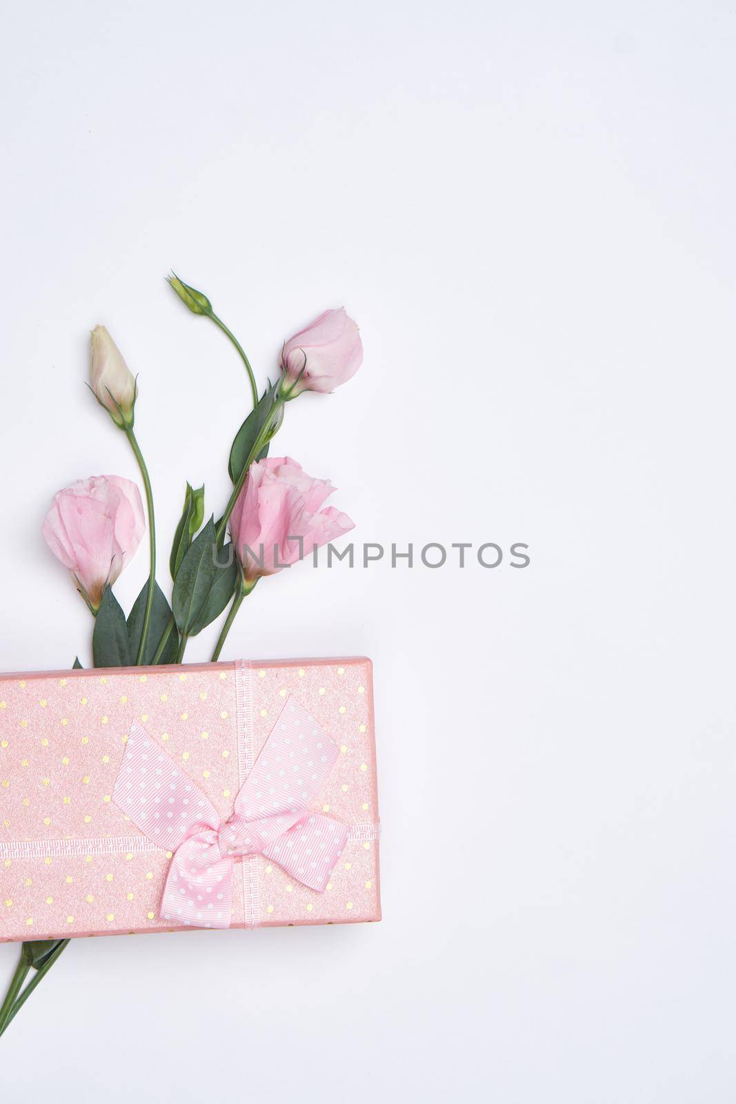 wedding gift flowers holiday light background top view. High quality photo